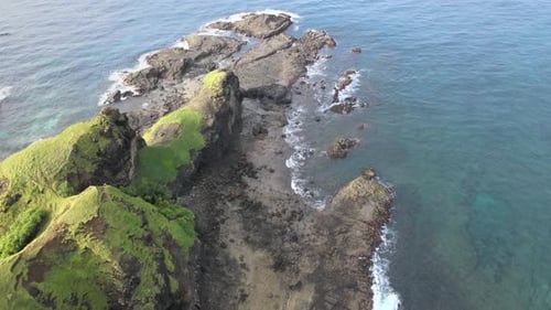 Calm Waves On The Rocks