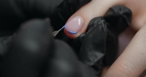 Adding Blue Nail Polish to Manicured Nail