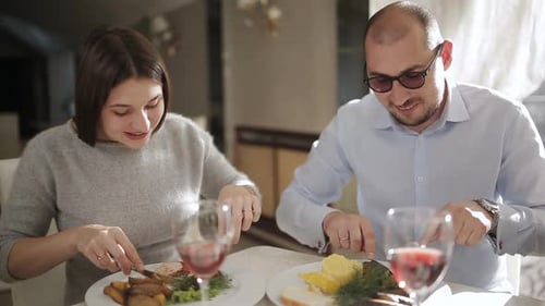 Guy and Girl Have Dinner in the Cosy Restaurant