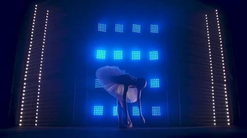 Ballerina Dancing on Stage with Blue Lights