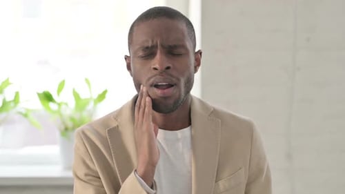 Man Experiences Toothache Pain, Close Up