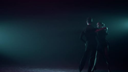 Ballroom Couple Dancing on Dark Stage