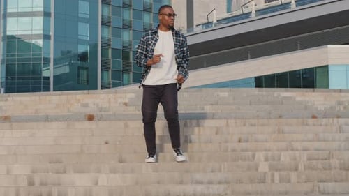 Young Man Descends Urban Steps With Style