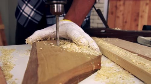 Carpenter Working on Wood Craft at Workshop