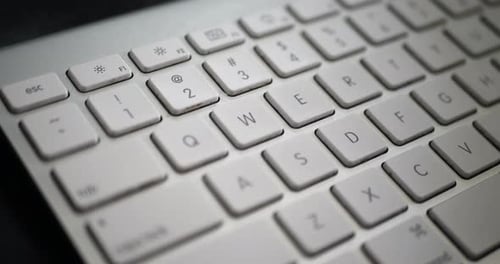 Close up Cleaning a Computer Keyboard with Wipe