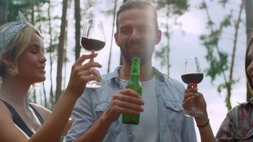 Happy Friends Clinking Glasses Outdoors