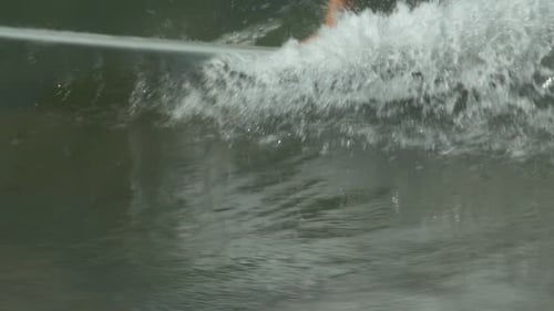 Surfer Riding Wave in Ocean Waters