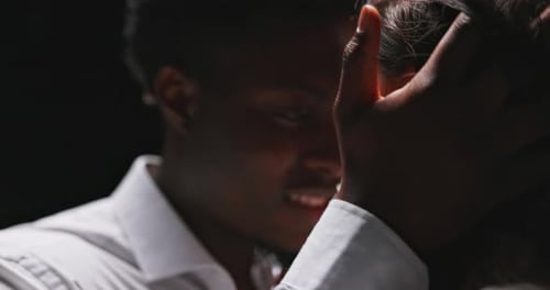 Close Up Of Loving Couple Embracing in Darkness