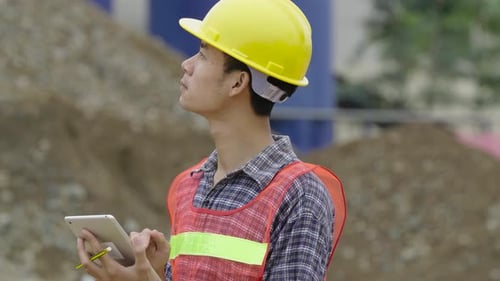 Architect Working With Tablet In Construction Site