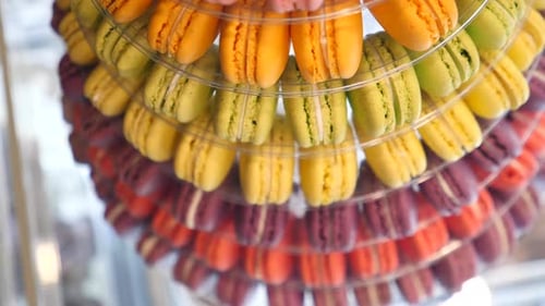 Famous Dessert Or Popular Confection: Macaron Tower of Various Colors Displayed In Cafe Bakery.