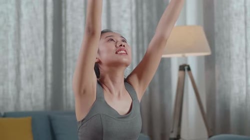 Young Asian Athletic Female Exercising, Stretching And Practicing Yoga At Home. Healthy Lifestyle