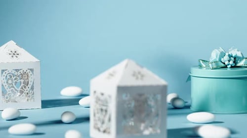 Elegant Gift Boxes with Candy on Blue Background