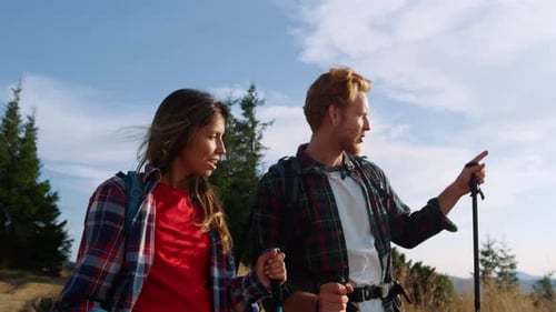 Couple Hiking Together on Mountain Trek