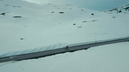 Drone Shot of Professional Road Cyclist in Winter