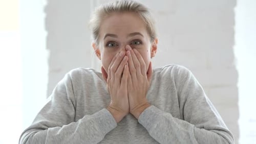 Woman Reacts with Surprise and Joy