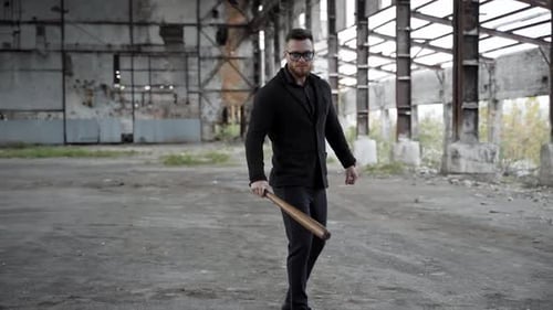 Intimidating Man with Bat Walks Forward