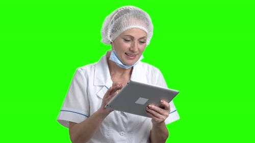 Woman Using Tablet on Green Screen