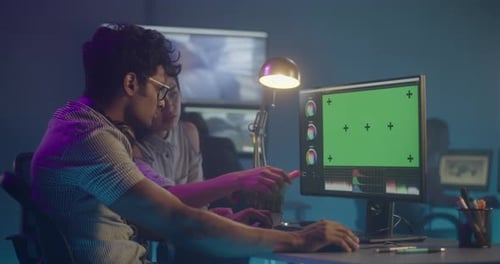 Video Editors at Work in Editing Room