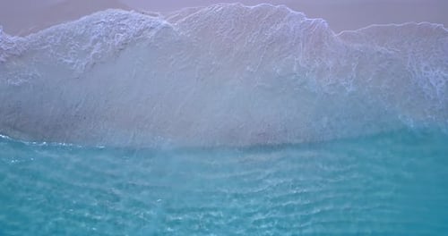 Daytime fly over abstract view of a summer white paradise sand beach and turquoise sea background in