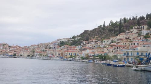 Coastal Town with Hillside Buildings and Harbor