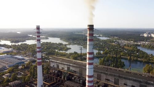 Environmental pollution by industrial plants throwing out harmful smoke from the chimney