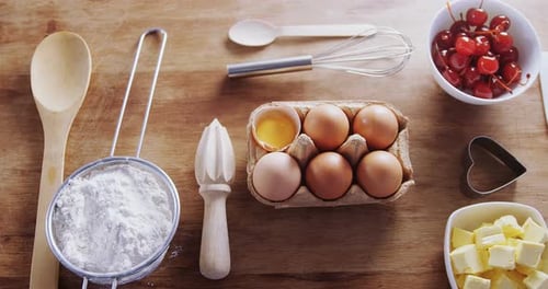 Baking Ingredients and Utensils on Wooden Table
