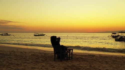 Beautiful happy lady on photoshoot spending quality time at the beach on summer white sand and blue