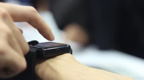 Hand Using Modern Black Smart Watch Device