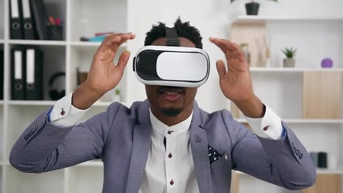 Man Using VR Headset in Bright Office