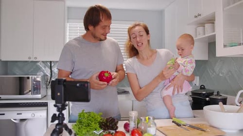 Happy Family Preparing Vegetables Together in Modern Kitchen