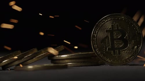 Cryptocurrency on the block chain - close up of bitcoin altcoin physical coins in dynamic setting