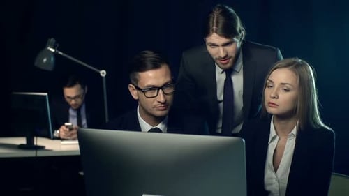 Team Collaborates Late in Urban Office