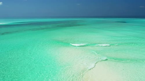 Beautiful birds eye abstract shot of a sandy white paradise beach and turquoise sea background