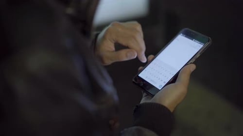 Adult Man Networking Smartphone in Night City