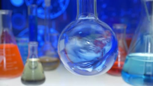 Blue Liquid Swirling in Round Bottom Flask