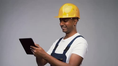 Happy Indian Builder in Helmet with Tablet Pc