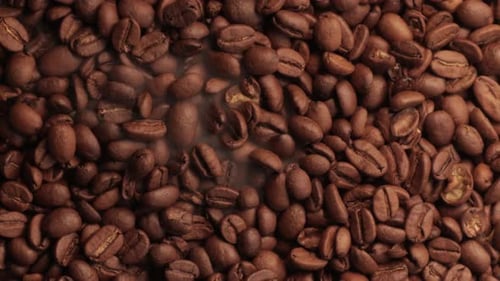 Brown Fragrant Coffee Beans Being Roasted in a Production Factory.