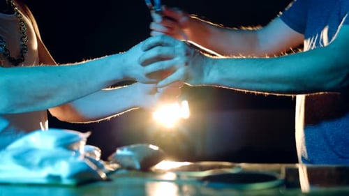 Handcuffing Crime Suspect at Table with Evidence