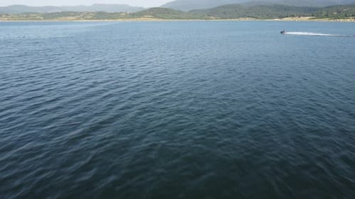 Aerial View of a Scooter at the Lake Surface