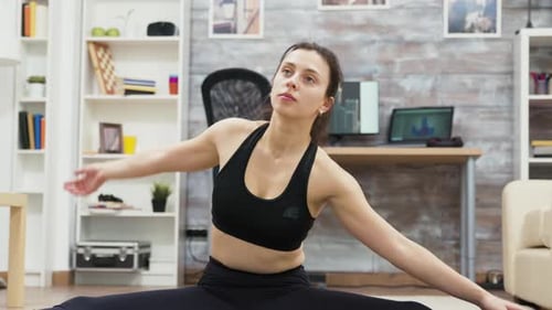 Woman Stretching and Doing a Full Split at Home