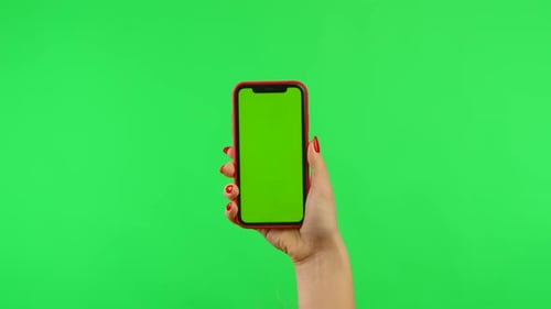 Woman Holds Mobile Phone with Workspace Mock Up Screen on Green Background in Vertical Position