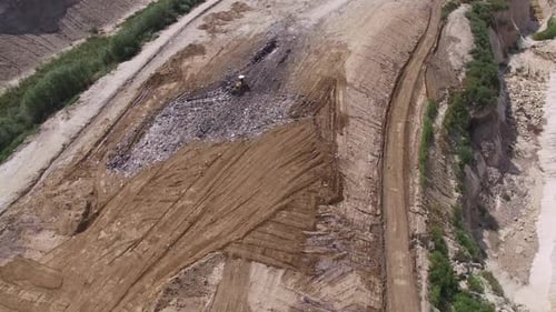 Aerial View of Landfill Site with Bulldozer