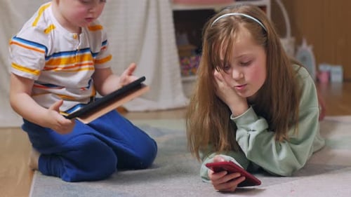 Young Children Using Devices Together Indoors