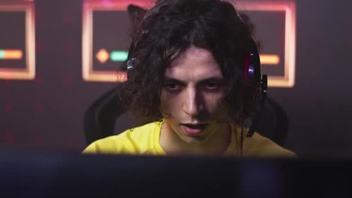 Concentrated Male Gamer Playing Video Game