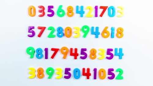 Colorful Numbers Rearranging on a White Background