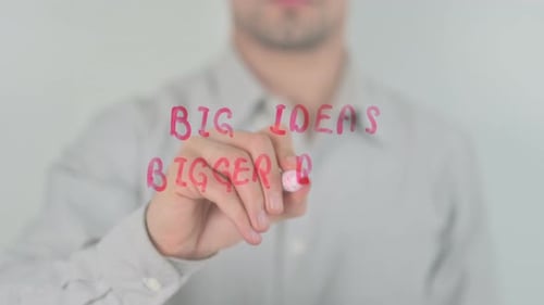 Man Writes Big Ideas Bigger Results on Glass