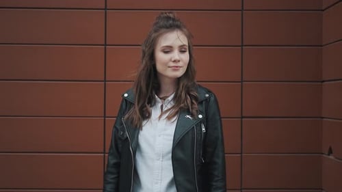 Stylish Young Woman in Leather Jacket
