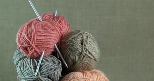 Colorful Yarn Balls with Knitting Needles Still Life