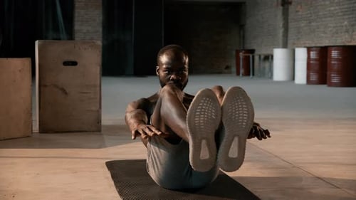 Sport man doing abs exercise workout at gym indoors. Fitness