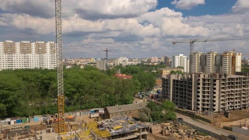 Construction Site Residential, Tower Cranes Working on Building, Cityscape, Sunny Day Moving Clouds